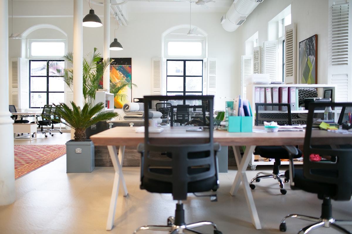 An empty meeting room with chairs around a table, no people and no brands, for the piece on collapsing employee engagement and the untrained managers who take the worst of it